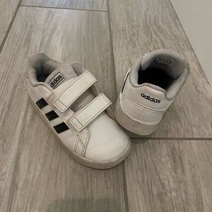 White and black adidas size 8. Worn condition. We grew out of them.